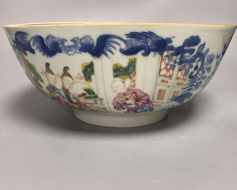 A Chinese famille rose punch bowl, Qianlong period, enamel painted in underglaze blue with famille rose enamels, figures in pavilions,
